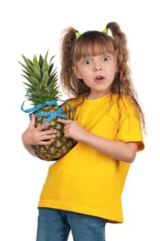Portrait of surprised little girl with pineapple and blue measure over white background
