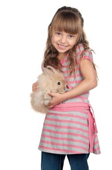 Easter concept image. Portrait of happy little girl with adorable rabbit over white background.