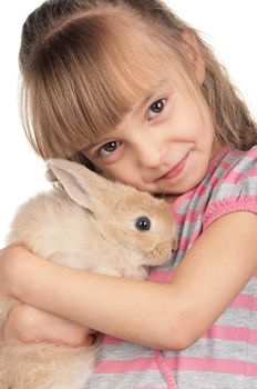 Easter concept image. Portrait of happy little girl with adorable rabbit over white background.