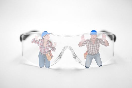 Man and woman stuck behind giant protective goggles