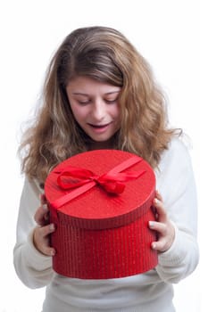 beautiful smiling blond woman opens a red gift box isolated on white 