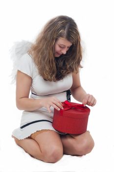 smiling christmas angel with golden hair on white background with wings and a gift 