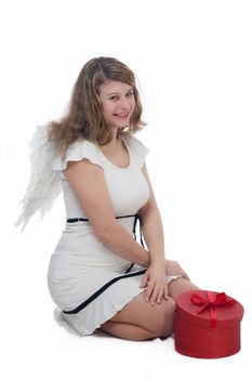 smiling christmas angel with golden hair on white background with wings and a gift 