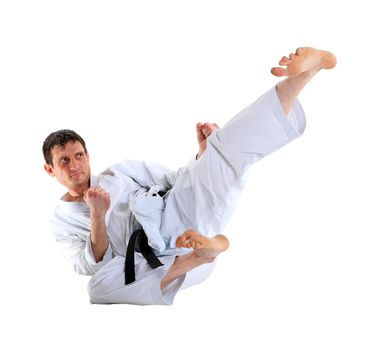 Karate jump against white background 
