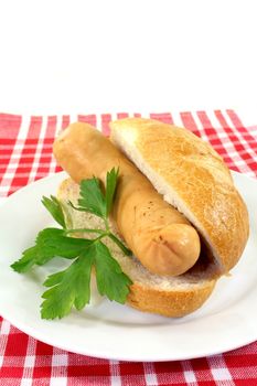 a scalded bockwurst in a sliced bun