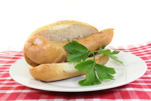 a scalded bockwurst in a sliced bun