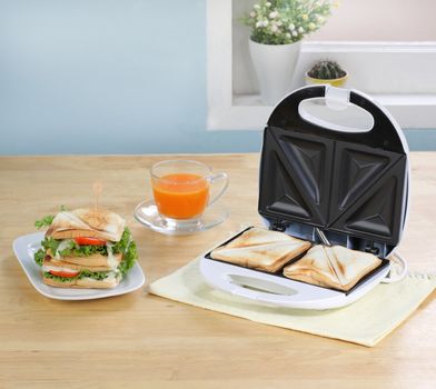 Sandwiches maker machine in the kitchen 