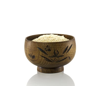 wooden cup with rice isolated on white