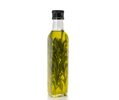 bottle olive oil with oregano isoalted on white