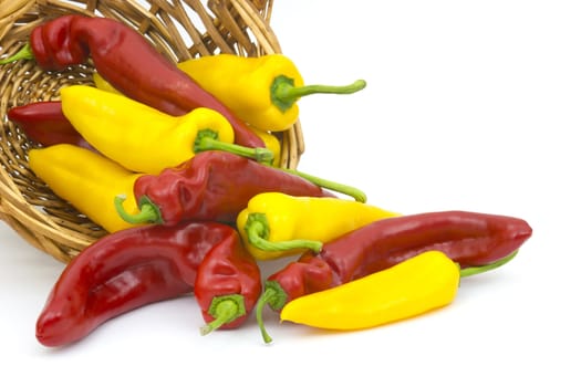 red and yellow peppers in a basket