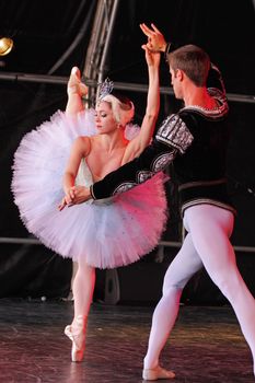 BRISTOL, ENGLAND - August 1: Megan Fairchild and Andrew Veyette of the New York City Ballet perform the White Swan pas de deux from Swan Lake in the Dance Village at the three day Harbour Festival in Bristol, England on August 1, 2010
