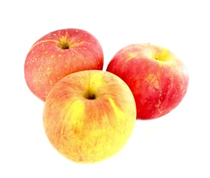 Fresh ripe red and yellow apples on white background