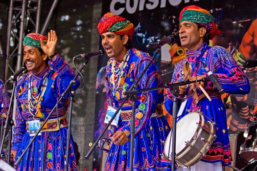 BRISTOL, ENGLAND - JULY 31: Members of the Jaipur Kawa brass band performing at the Harbour Festival in Bristol, England on July 31, 2010. Founded in 1971, this free three day event played host to more than 250,000 spectators