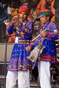 BRISTOL, ENGLAND - JULY 31: Members of the Jaipur Kawa brass band performing at the Harbour Festival in Bristol, England on July 31, 2010. Founded in 1971, this free three day event played host to more than 250,000 spectators