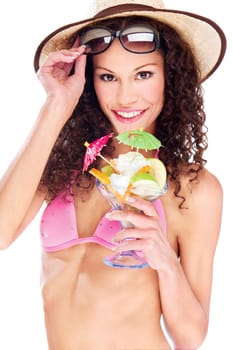 Pretty woman in bikini holding cup of fruits, isolated on white background