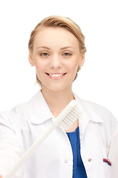 picture of attractive female doctor with toothbrush...