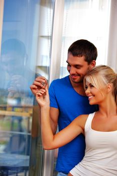 bright picture of happy couple with keys