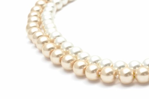 Beautiful pearl necklace closeup on white background