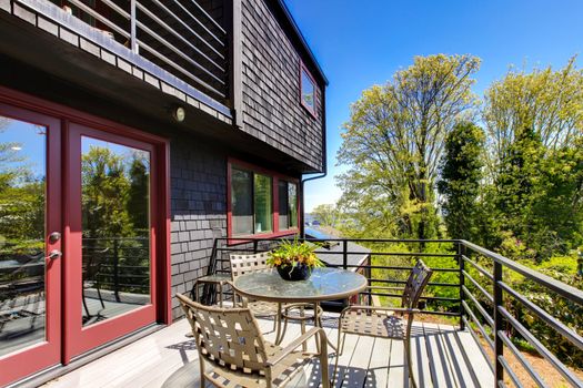 Deck with furniture of Beautiful modern home during spring day