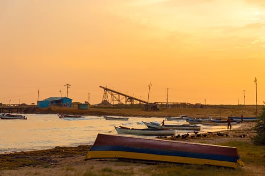 Boats on the shore early in the morning in Manaure, Colombia