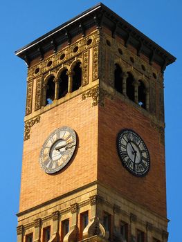 A photograph of a clock tower on a government building detailing its unique architectural design.