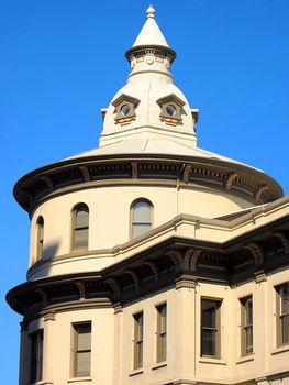 A photograph of a commercial building detailing its unique architectural design.