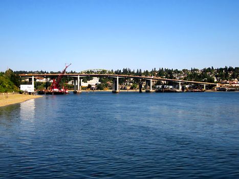 A photograph of a town located near a waterway.