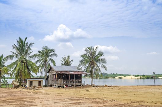 village house by river in rural cambodia