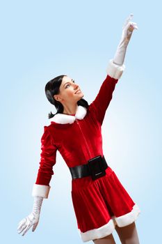 Santa Girl presenting your product, in costume and white gloves