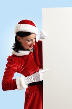 Portrait of a santa girl with a blank banner