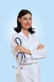 Portrait of happy successful young female doctor holding a stethoscope