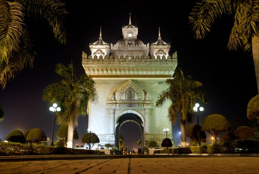 patuxai arch at night in vientiane, laos