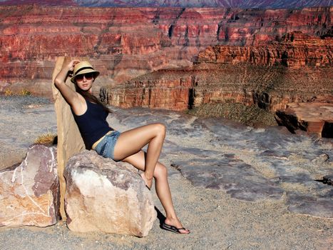 The beautiful young girl at the end of midday in the Grand Canyon Arizona