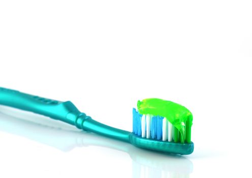 Tooth-brush with tooth paste over white 