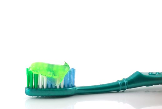 Tooth-brush with tooth paste over white