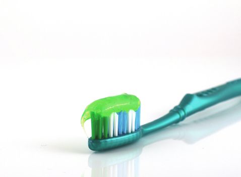 Tooth-brush with tooth paste over white