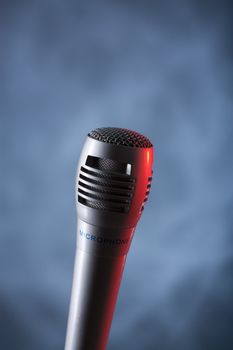 the single microphone vertical on the dark background