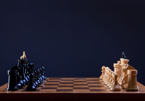 beginning of chess game on dark background