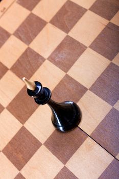 a black chess Queen on the Board