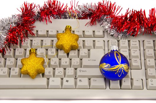 computer keyboard fragment with Christmas toys isolated  on white 