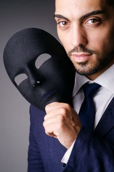 Man with black mask in studio