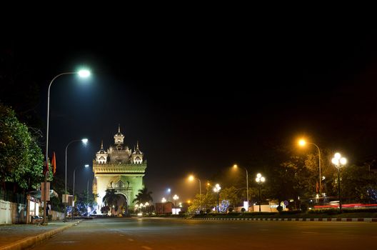 patuxai arch at night in central vientiane, laos