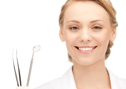 picture of attractive female dentist with tools....