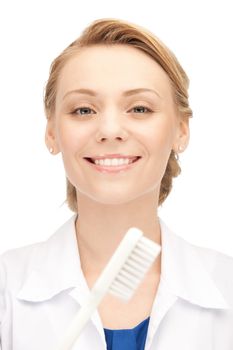 picture of attractive female doctor with toothbrush...