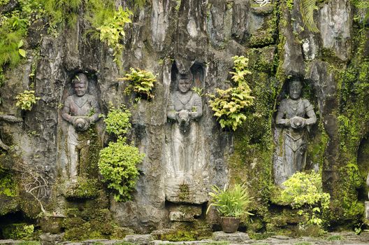 traditional statues in bali indonesia garden