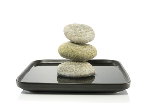 tower of stones in  balance in water