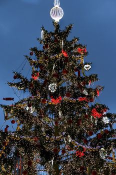 Big beautiful well decorated Christmas tree wit a lot of lights