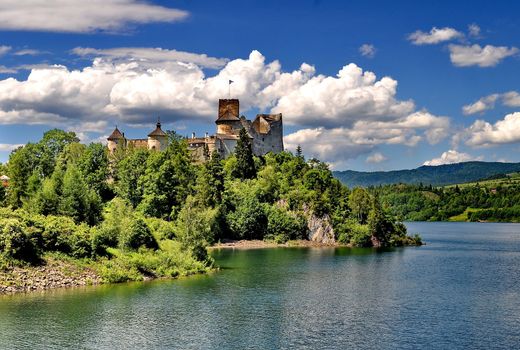 Castle on a hill besides a lake (Nedec, Poland)