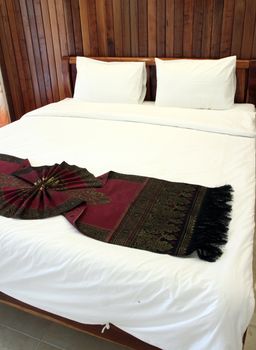 Beautiful double bed in traditional Thai setting