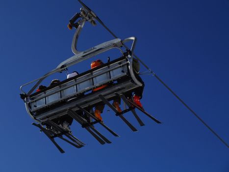 Ski lift carrying skiers.